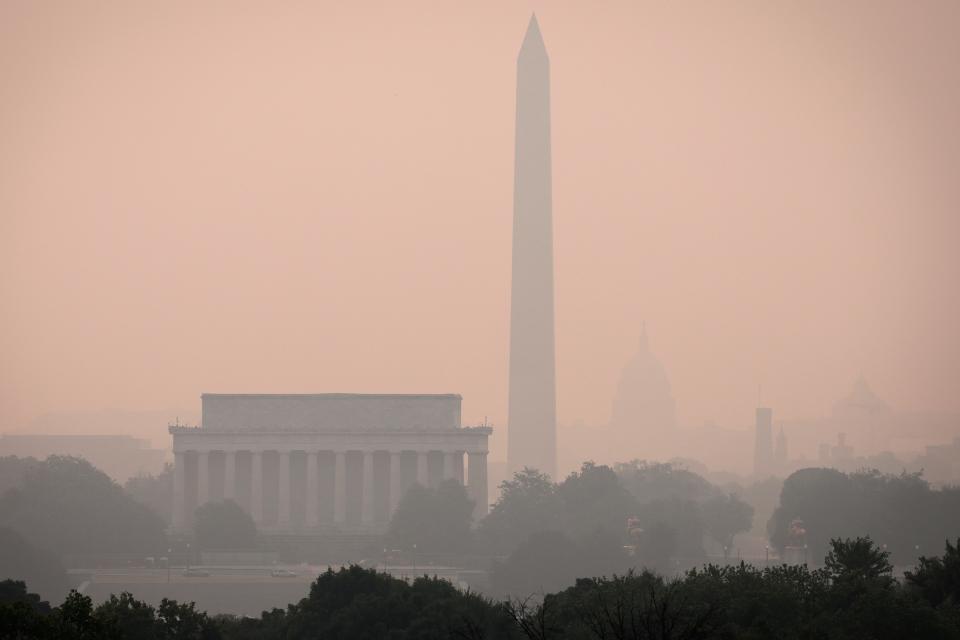 ARLINGTON, VIRGINIA - JUNE 07: Hazy skies caused by Canadian wildfires blanket the monuments and skyline of Washington, DC on June 7, 2023 as seen from Arlington, Virginia. The Washington DC area is under a Code Orange air quality alert indicating unhealthy air for some members of the general public.