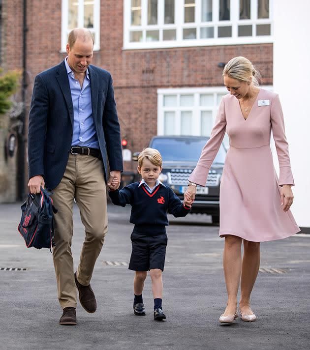 Prince George held on to his father, Prince William, and his teacher, Ms Helen Haslem's hand as he made his way into the school. Photo: Getty Images