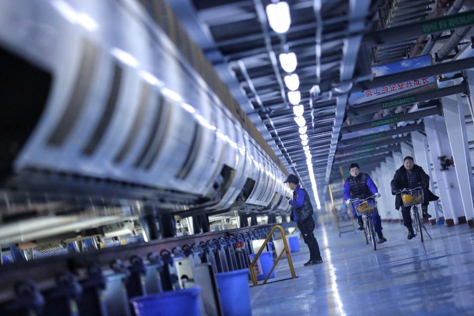 Maintenance workers ride bicycles to inspect trains at a maintenance depot the night before the first day of the annual Spring Festival travel rush, ahead of the Chinese Lunar New Year in Beijing, China January 9, 2020.