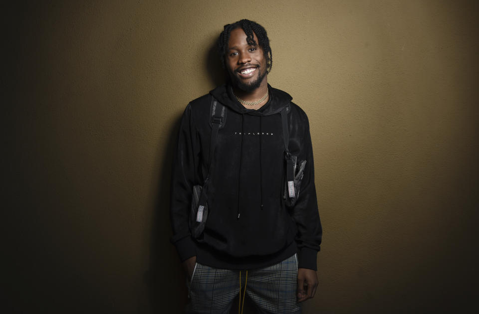 In this Nov. 30, 2018 photo, Shameik Moore, a cast member in "Spider-man: Into the Spider-Verse," poses for a portrait at the Four Seasons Hotel in Los Angeles. (Photo by Chris Pizzello/Invision/AP)