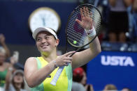 Jelena Ostapenko, of Latvia, celebrates after defeating Iga Swiatek, of Poland, during the fourth round of the U.S. Open tennis championships, Sunday, Sept. 3, 2023, in New York. (AP Photo/John Minchillo)