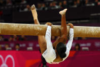 LONDON, ENGLAND - AUGUST 07: Gabrielle Douglas of the United States falls off the beam during the Artistic Gymnastics Women's Beam final on Day 11 of the London 2012 Olympic Games at North Greenwich Arena on August 7, 2012 in London, England. (Photo by Michael Regan/Getty Images)