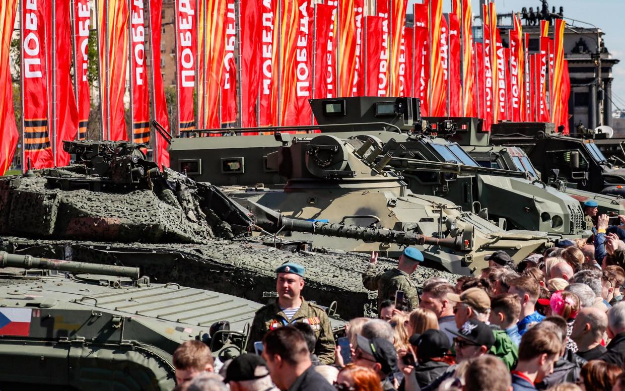 Crowds examine military vehicles captured by Russian troops during the conflict in Ukraine, at an exhibition in Moscow