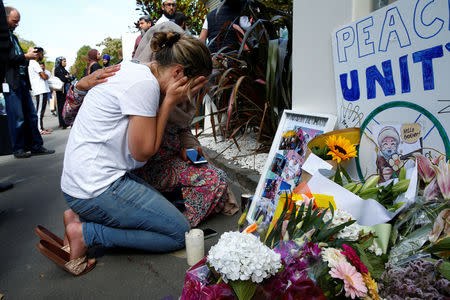 A woman reacts at a make shift memorial outside the Al-Noor mosque in Christchurch, New Zealand March 23, 2019. REUTERS/Edgar Su