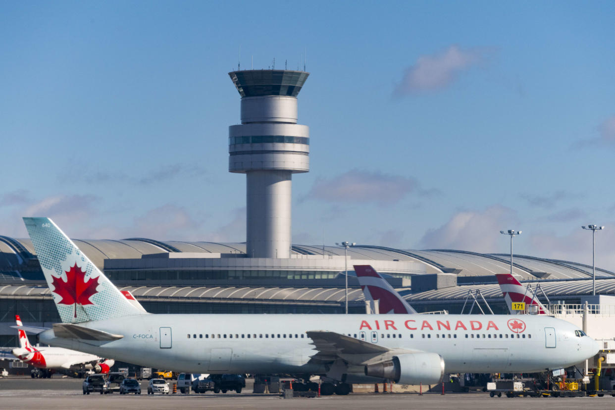TORONTO, ONTARIO, CANADA - 2017/03/03: Air Canada plane in Pearson International Airport with the Control Tower in the background. (Photo by Roberto Machado Noa/LightRocket via Getty Images)