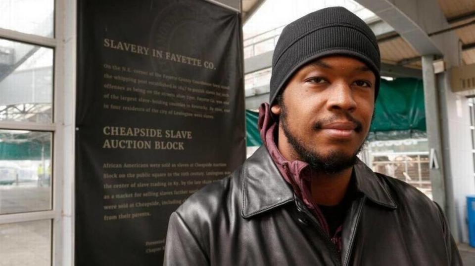 DeBraun Thomas, one of the co-founders of Take Back Cheapside, stood next to explanatory text in the Fifth Third Bank Pavilion in the former Cheapside, now named Tandy Park.