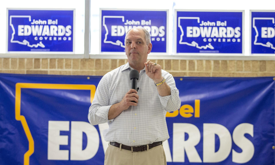 FILE - In this July 8, 2019 file photo, Louisiana Gov. John Bel Edwards stumps for re-election during a campaign stop in New Orleans, La. While Democrats in Washington charge ahead with an impeachment inquiry, their party's candidates for governor in three Southern states are doing their best to steer the conversation away from Republican President Donald Trump and toward safer ground back home. Edwards, who leads in the polls, faces two major Republican opponents in the Oct. 12 primary. (David Grunfeld/The Advocate via AP, File)