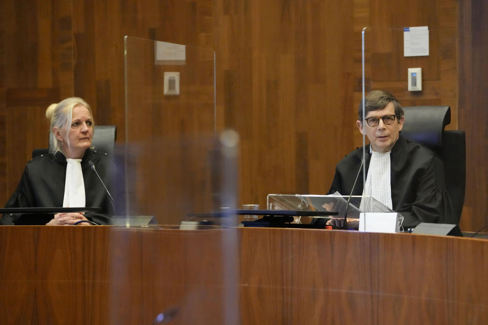 Presiding judge Boele, right, prepares to read the verdict in an appeals court in The Hague, Netherlands, Tuesday Dec. 7, 2021, after a Hague District Court had ruled in January 2020 that the case against Benny Gantz and former Israeli air force commander Amir Eshel could not proceed because the men have "functional immunity from jurisdiction". The case was brought by Ismail Ziada, a Dutch-Palestinian who lost six members of his family in the airstrike that lawyers for the men argued was part of an Israeli military operation during the 2014 Gaza conflict. (AP Photo/Peter Dejong)