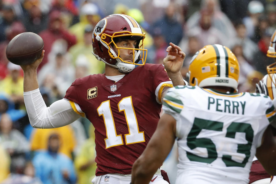 Washington Redskins quarterback Alex Smith (11) prepares to pass the ball during the first half of an NFL football game against the Green Bay Packers, Sunday, Sept. 23, 2018, in Landover, Md. (AP Photo/Alex Brandon)
