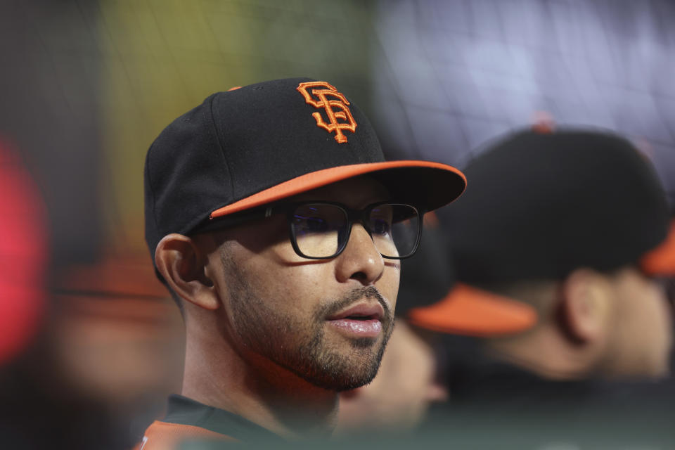 San Francisco Giants interim manager Kai Correa stands in the dugout during the third inning of the team's baseball game against the Los Angeles Dodgers in San Francisco, Friday, Sept. 29, 2023. (AP Photo/Jed Jacobsohn)
