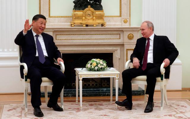 President Xi and Putin - Sergei Karpukhin, Sputnik, Kremlin Pool Photo via AP, File