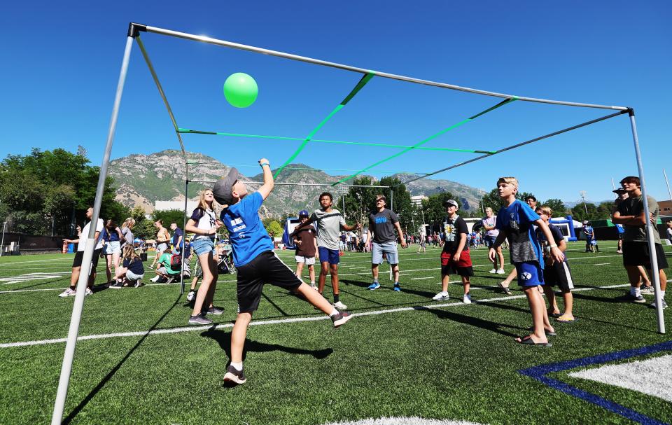 Kids play nine square on the outdoor practice field as BYU holds a party to celebrate their move into the Big 12 Conference with music, games and sports exhibits in Provo on Saturday, July 1, 2023. | Scott G Winterton, Deseret News