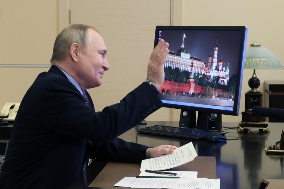 Russian President Vladimir Putin gestures as he takes part in a ceremony to launch new and renovated transport infrastructure via videoconference at the Novo-Ogaryovo residence outside Moscow, Russia, Tuesday, Dec. 13, 2022. (Mikhail Metzel, Sputnik, Kremlin Pool Photo via AP)