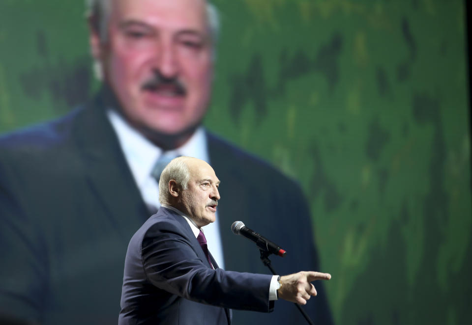 Belarusian President Alexander Lukashenko gestures as he addresses a women's forum in Minsk, Belarus, Thursday, Sept. 17, 2020. President Alexander Lukashenko's decision to close the borders with Poland and Lithuania underlines his repeated claim that the massive wave of protests is driven by the West and comes amid increasing criticism from the United States and the European Union. (TUT.by via AP)