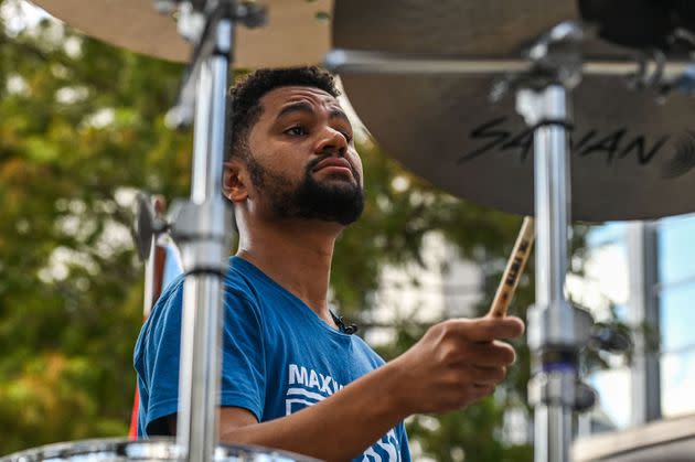 Maxwell Frost, a Democratic candidate for Florida's 10th Congressional district, plays the drums during the Pride Parade in Orlando, Florida, on October 15, 2022. (Photo: Giorgio Viera/AFP via Getty Images)