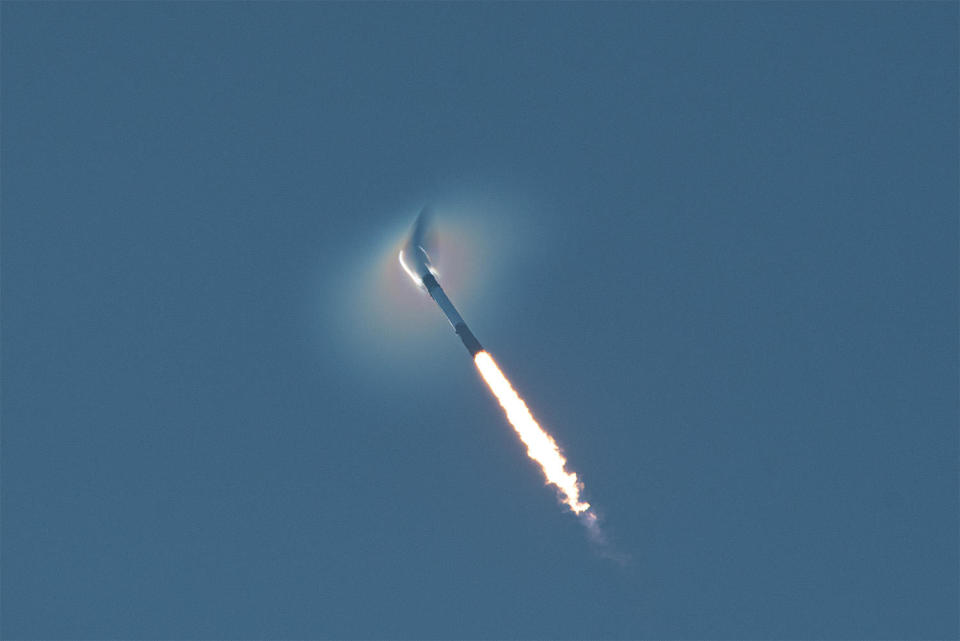 The Falcon 9 compresses the air in front of it as the booster exits the dense lower atmosphere. / Credit: William Harwood/CBS News