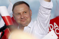 In this Tuesday, July 7, 2020 photo Poland's incumbent president Andrzej Duda, who is seeking reelection in a tight presidential election runoff on Sunday, July 12, 2020 attends a rally in Lomza, Poland. Duda, who has backing from Poland's ruling right-wing party, is running against liberal Warsaw mayor, Rafal Trzaskowski. Opinion polls suggest the election may be decided by a small number of votes. (AP Photo/Czarek Sokolowski)