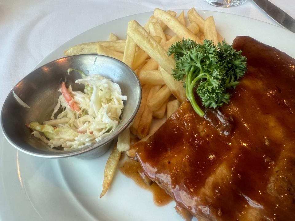 BBQ pork and french fries with cole slaw.