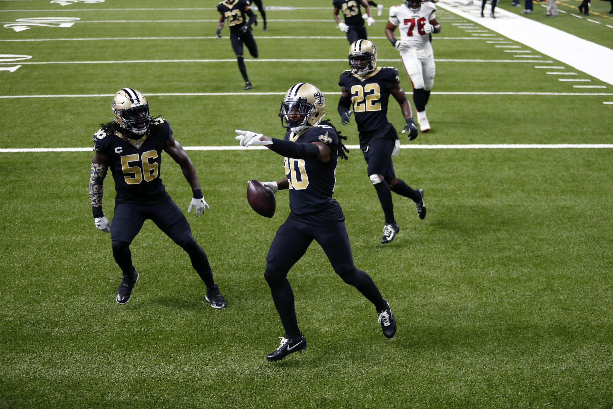 New Orleans Saints cornerback Janoris Jenkins (20) celebrates his pick six with outside linebacker Demario Davis (56) and safety Chauncey Gardner-Johnson (22) in the second half of an NFL football game against the Tampa Bay Buccaneers