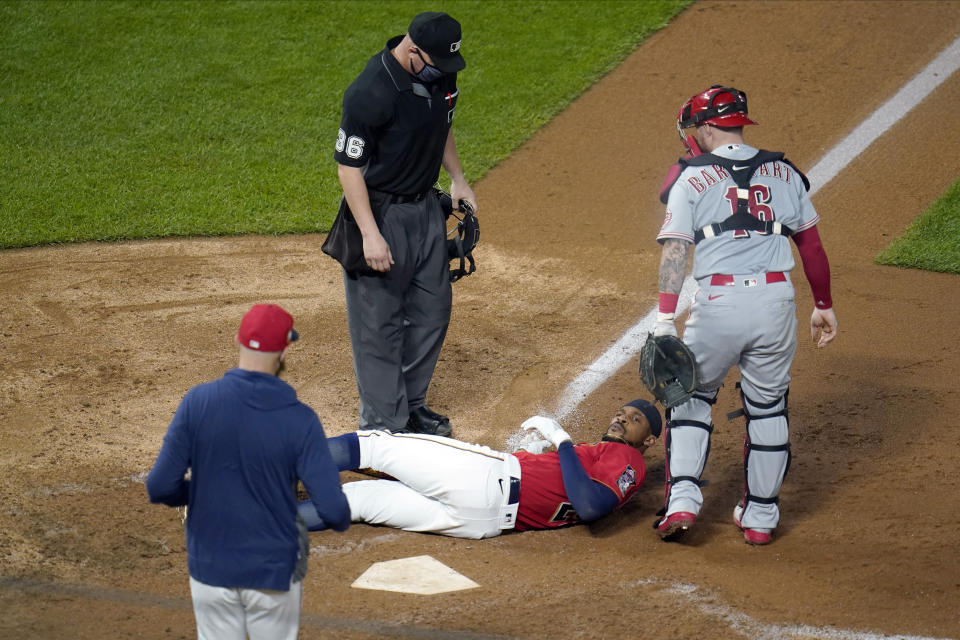 Minnesota Twins' Byron Buxton lies on the ground after being hit by a pitch from Cincinnati Reds' Lucas Sims during the eighth inning of a baseball game Friday, Sept. 25, 2020, in Minneapolis. (AP Photo/Jim Mone)