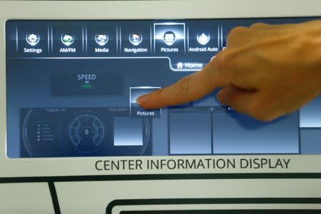 A person operates a 'SmartCore' dashboard at the technical center of U.S. automotive supplier Visteon in Karlsruhe, Germany June 23, 2017. Picture taken June 23, 2017. REUTERS/Ralph Orlowski