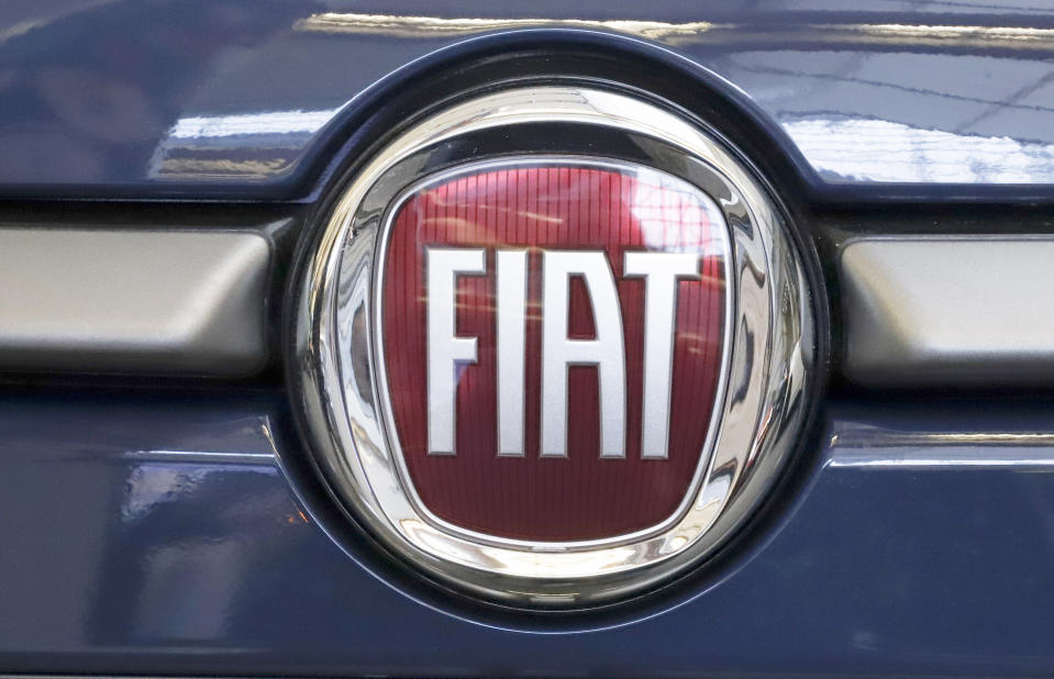 FILE - In this Feb. 14, 2019, file photo, this is the Fiat logo is mounted on a 2019 500 L on display at the 2019 Pittsburgh International Auto Show in Pittsburgh. French carmaker Renault looks set to give its approval to Fiat Chrysler's merger offer. The company's board is meeting Tuesday June 4, 2019 afternoon at its headquarters outside Paris to decide on a deal that could reshape the global auto industry. (AP Photo/Gene J. Puskar, File)