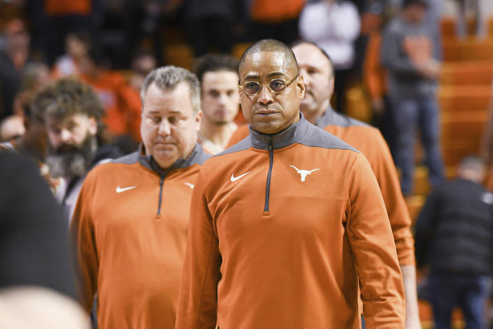 Texas interim head coach Rodney Terry walks the court with his staff following a win over Oklahoma State in an NCAA college basketball game Saturday, Jan. 7, 2023, in Stillwater, Okla. Texas defeated Oklahoma State 56-46. (AP Photo/Brody Schmidt)