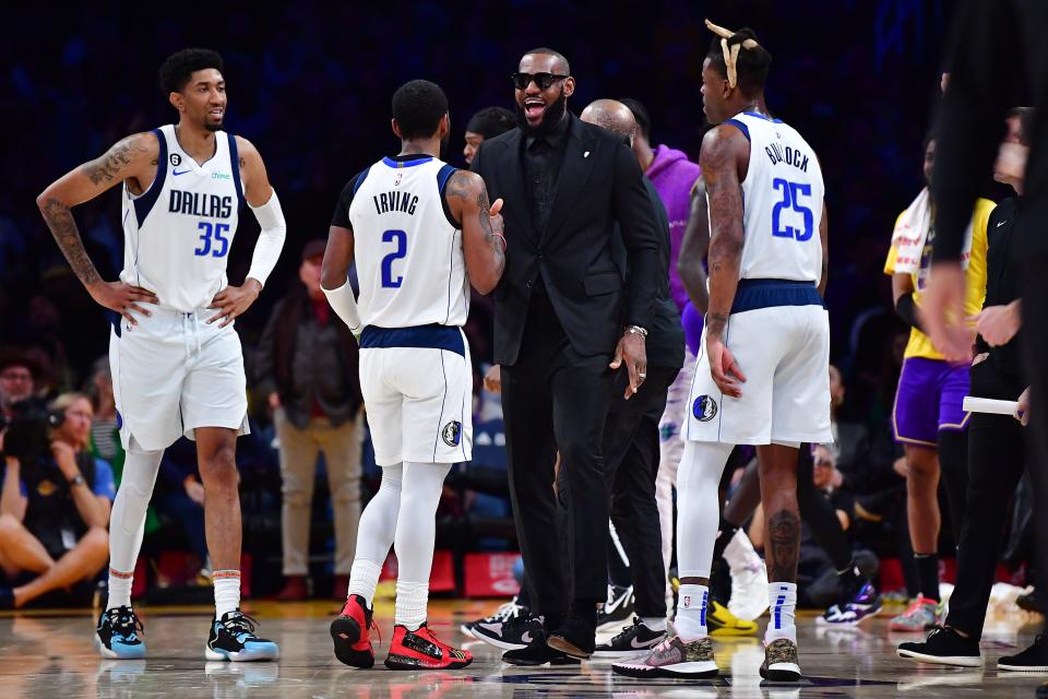 Mar 17, 2023; Los Angeles Lakers forward LeBron James (6) meets with Dallas Mavericks guard Kyrie Irving (2) in the second half at Crypto.com Arena. (Photo: Gary A. Vasquez, USA TODAY Sports)