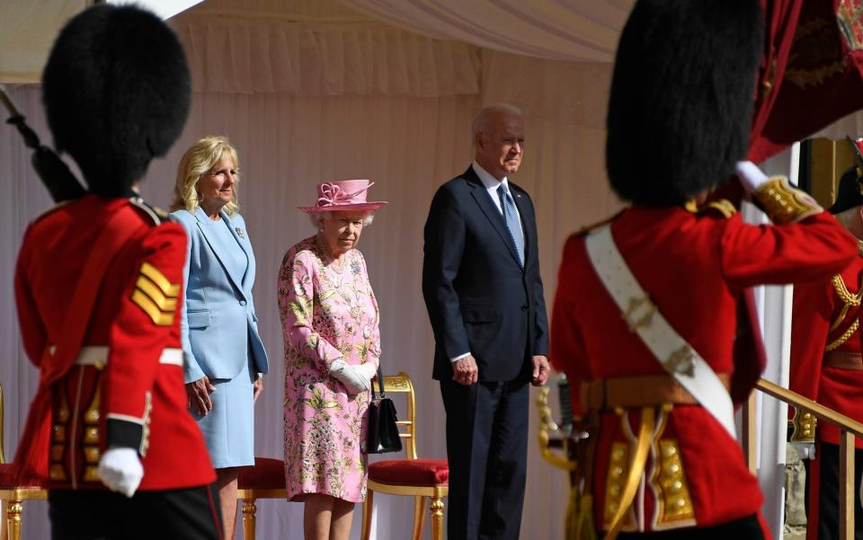 The US President takes the salute from a Guard of Honour  - Alberto Pezzali/AP