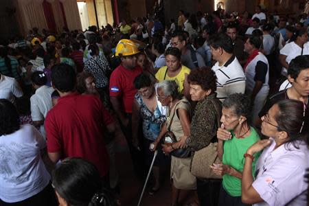 People evacuate the Metropolitan Cathedral after a 6.6 magnitude earthquake in Managua April 11, 2014. REUTERS/Oswaldo Rivas