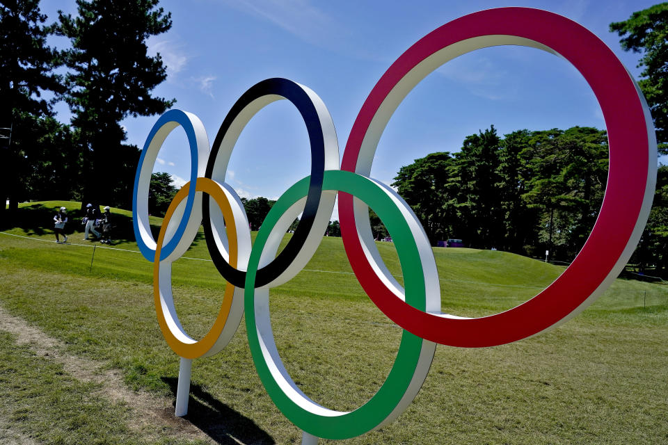 Golfers walks to the putting green during a practice round prior to the women's golf event at the 2020 Summer Olympics, Tuesday, Aug. 3, 2021, at the Kasumigaseki Country Club in Kawagoe, Japan. (AP Photo/Matt York)