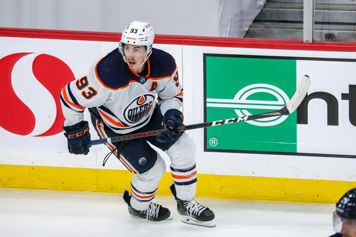 WINNIPEG, MB - MAY 24: Ryan Nugent-Hopkins #93 of the Edmonton Oilers keeps an eye on the play during action in the second overtime period against the Winnipeg Jets in Game Four of the First Round of the 2021 Stanley Cup Playoffs at Bell MTS Place on May 24, 2021 in Winnipeg, Manitoba. (Photo by Jonathan Kozub/NHLI via Getty Images)