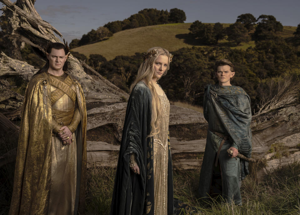 This image released by Amazon Studios shows Benjamin Walker, from left, Morfydd Clark and Robert Aramayo from "The Lord of the Rings: The Rings of Power." (Amazon Studios via AP)