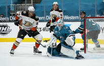 San Jose Sharks goaltender Martin Jones (31) makes a save against the Anaheim Ducks as left wing Max Comtois (53) looks on during the second period of an NHL hockey game in San Jose, Calif., Monday, Feb. 15, 2021. (AP Photo/Tony Avelar)