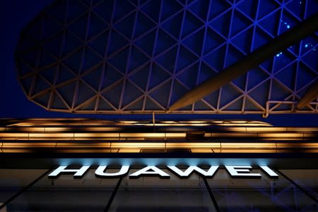 FILE PHOTO: A Huawei company logo is seen at a shopping mall in Shanghai