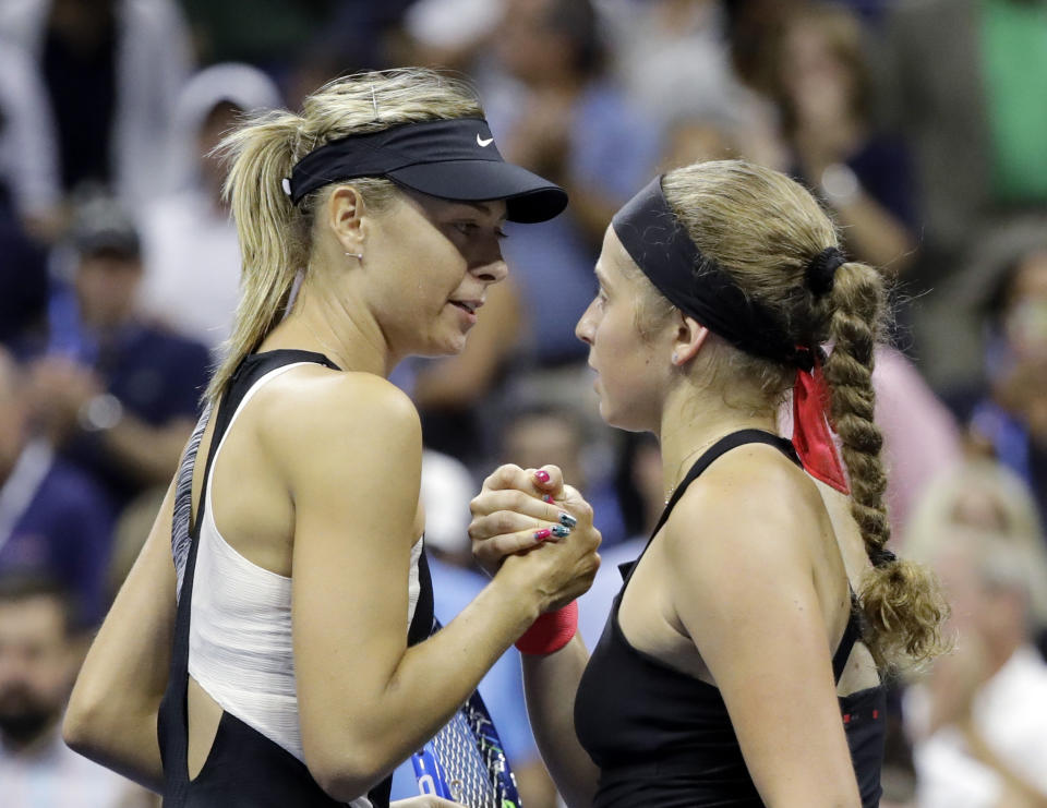 Maria Sharapova, of Russia, shakes hands with Jelena Ostapenko, of Latvia, after Sharapova defeated Ostapenko during the third round of the U.S. Open tennis tournament, Saturday, Sept. 1, 2018, in New York. (AP Photo/Darron Cummings)