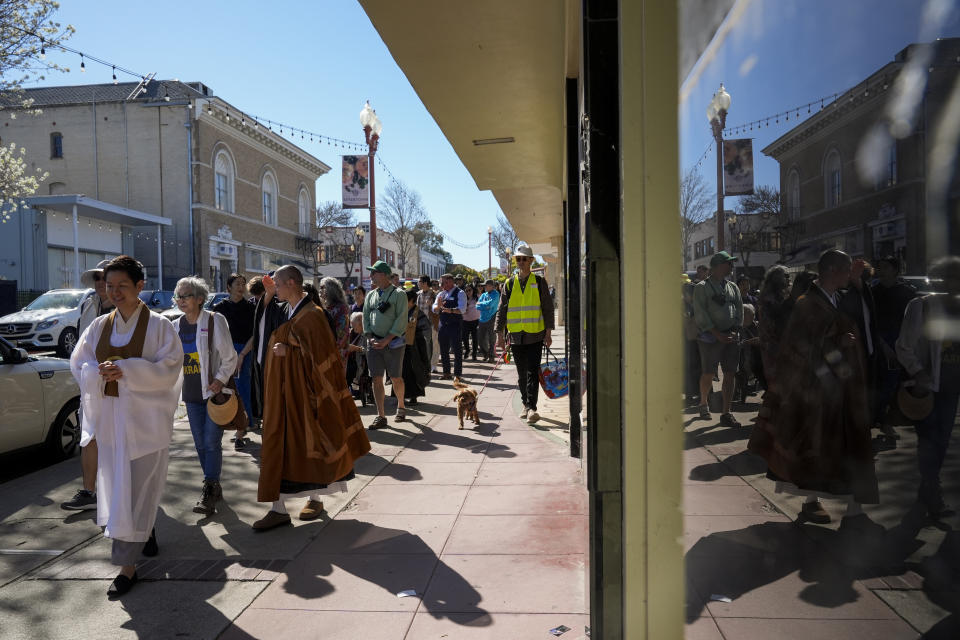 Buddhist faith leaders and community members participate in a "May We Gather" pilgrimage, Saturday, March 16, 2024, in Antioch, Calif. The event aimed to use karmic cleansing through chants, prayer and testimony to heal racial trauma caused by anti-Chinese discrimination in Antioch in the 1870s. (AP Photo/Godofredo A. Vasquez)