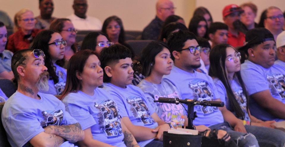 Some attending the first Texas Leadership Charter Academy graduation in Abilene wore matching blue shirts to celebrate a family accomplishment.