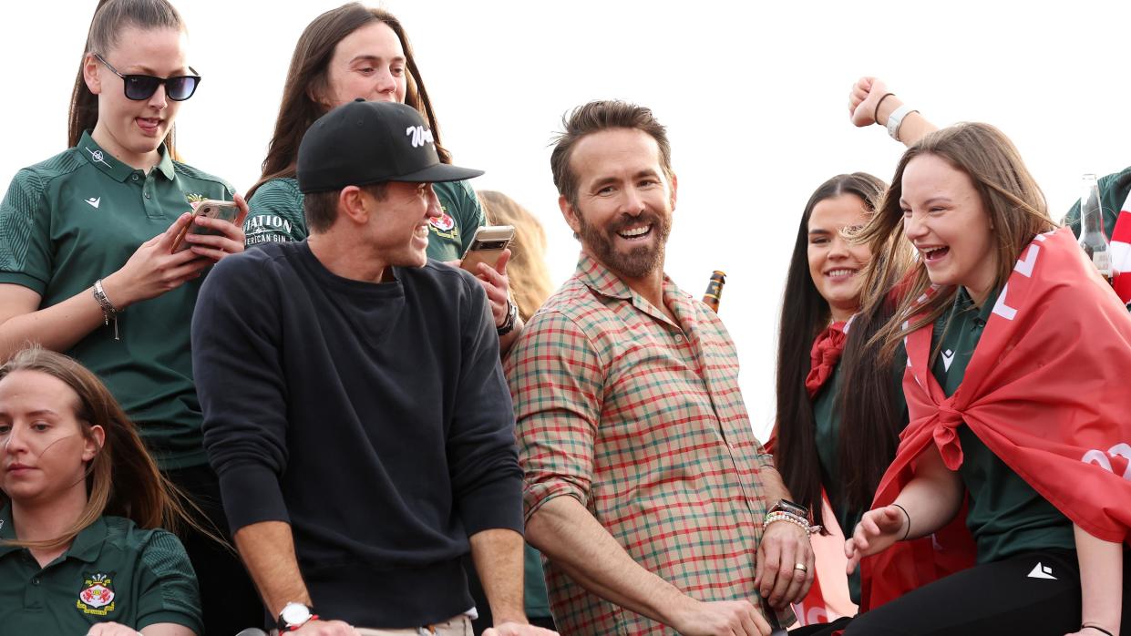 Rob McElhenney and Ryan Reynolds celebrate Wrexham's promotion in 2023