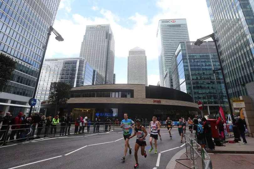 Participants run through Canary Wharf