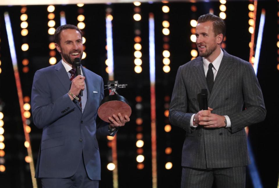 Recognised: England manager Gareth Southgate accepts his Coach of the Year award. (PA)