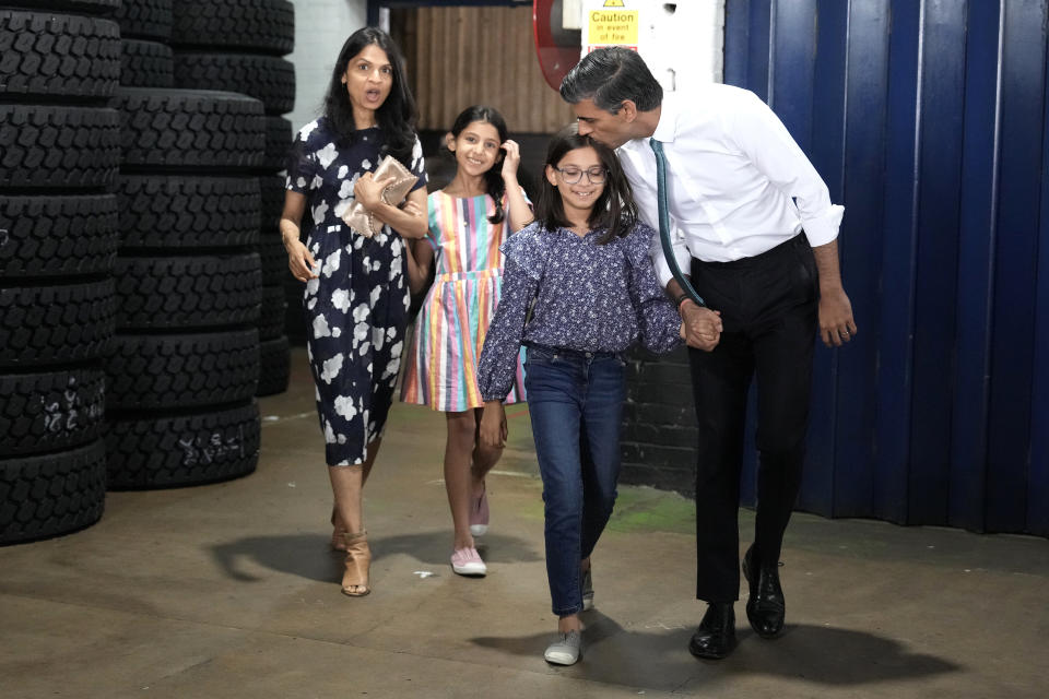 GRANTHAM, ENGLAND - JULY 23: Conservative Leadership hopeful Rishi Sunak with daughters Krisna, Anoushka and wife Akshata Murthy after making a speech while campaigning on July 23, 2022 in Grantham, England. Former Chancellor Rishi Sunak has chosen Grantham, a Conservative party heartland and the home town of former PM Margaret Thatcher, as the next stop of his campaign to become the leader of the Conservative party and Prime Minister. Sunak has promised “a return to traditional Conservative economic values” and will cut taxes only after inflation is under control (Photo by Christopher Furlong/Getty Images,)