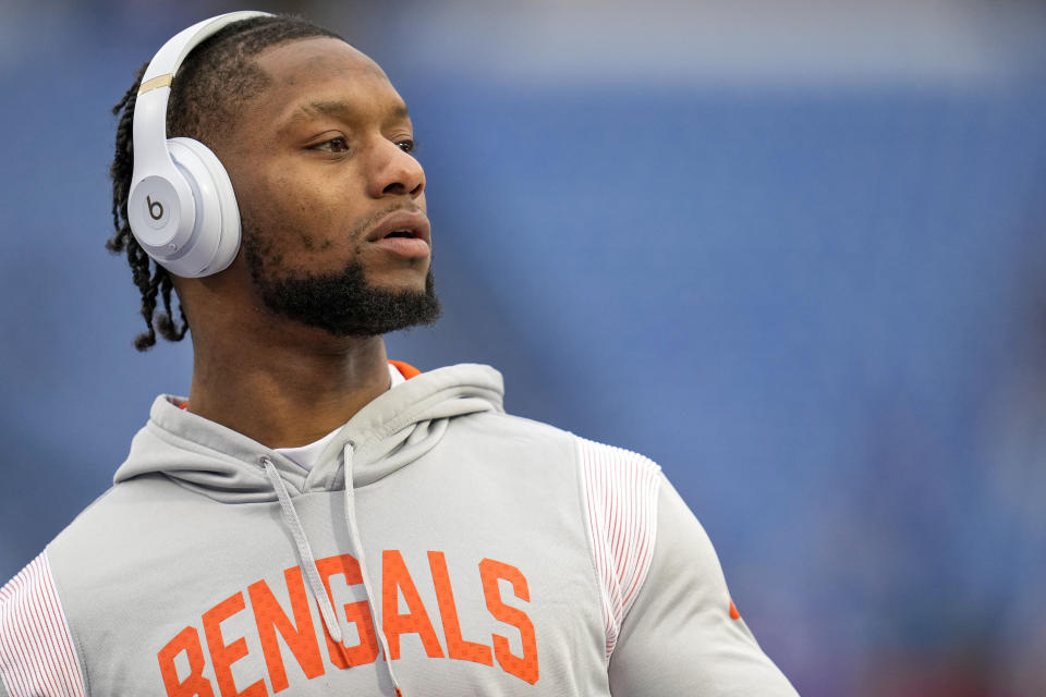 Jan 22, 2023; Orchard Park, New York, USA; Cincinnati Bengals running back Joe Mixon (28) throws passes with fans during warmups before an AFC divisional round game against the Buffalo Bills at Highmark Stadium. Mandatory Credit: Sam Greene-USA TODAY Sports