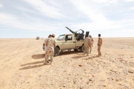 Libyan soldiers stand at a military outpost in Wadi Bey, west of the Islamic State-held city of Sirte, February 23, 2016 REUTERS/Ismail Zitouny