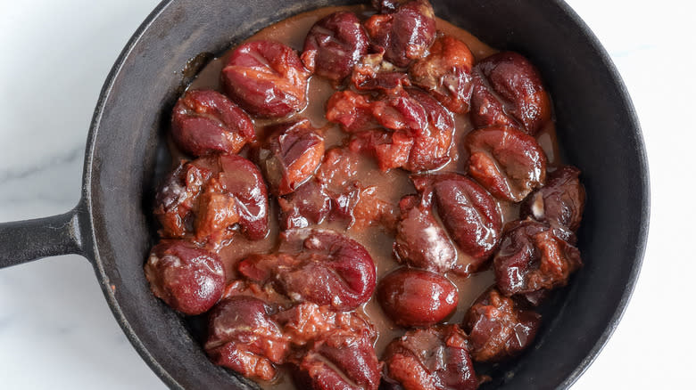 plums in cast-iron skillet