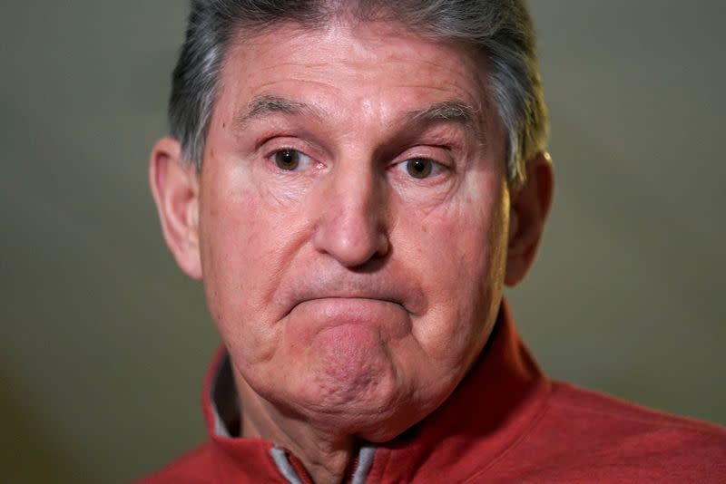 FILE PHOTO: Joe Manchin speaks to reporters on Capitol Hill in Washington