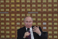 Russian President Vladimir Putin gestures while speaking during a meeting with French delegation in Simferopol, Crimea, Monday, March 18, 2019. Putin visited Crimea to mark the fifth anniversary of Russia's annexation of Crimea from Ukraine by visiting the Black Sea peninsula. (Yuri Kadobnov/Pool Photo via AP)