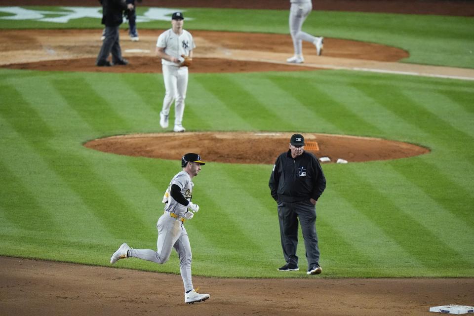 New York Yankees pitcher Clarke Schmidt, above, watches Oakland Athletics' Brent Rooker run the bases after hitting a three-run home run during the sixth inning of a baseball game, Wednesday, April 24, 2024, in New York. (AP Photo/Frank Franklin II)