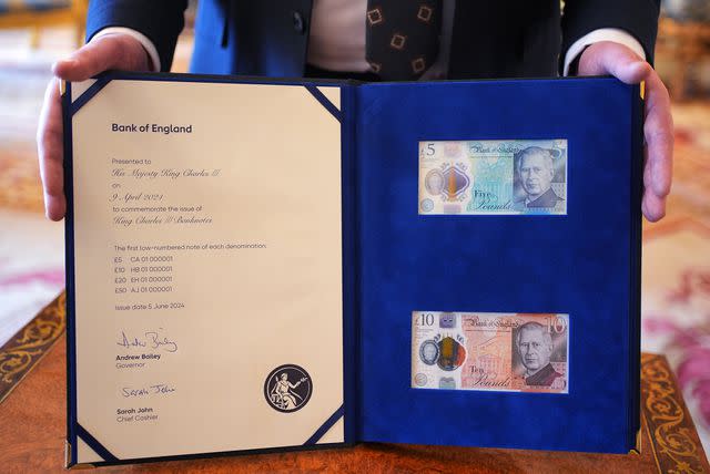 <p>Yui Mok - WPA Pool/Getty</p> The new bank notes featuring King Charles' portrait, set to enter circulate on June 5, as presented to the King at Buckingham Palace on April 9, 2024.