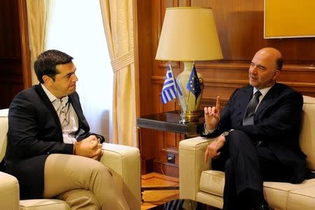 European Economic and Financial Affairs Commissioner Pierre Moscovici meets with Greek Prime Minister Alexis Tsipras at the Maximos Mansion in Athens, Greece July 18, 2016. REUTERS/Michalis Karagiannis